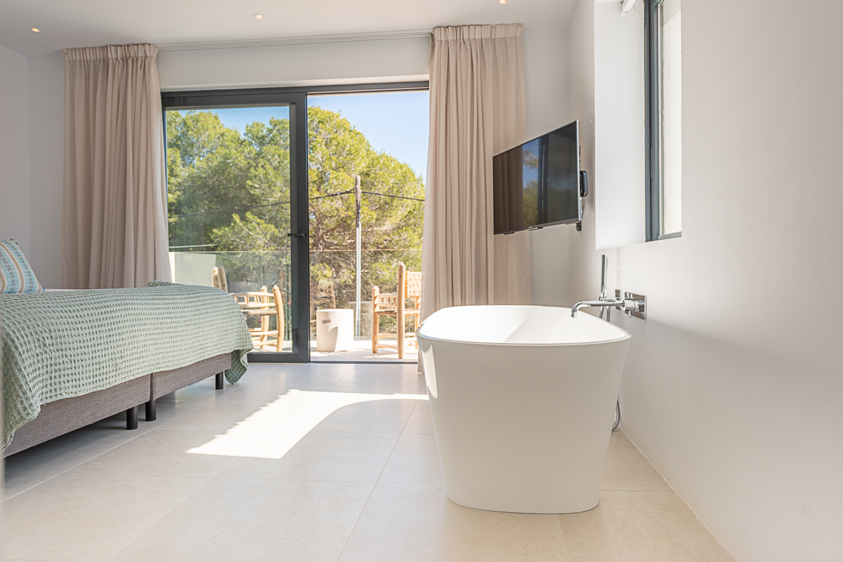 Resa estate modern villa for sale ibiza first line north tub bedroom.jpg